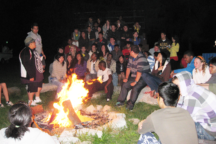 Camp Wahanowin in Orillia was home to this year Biz Frosh. Here students relaxed around a campfire. Facebook.com Photo