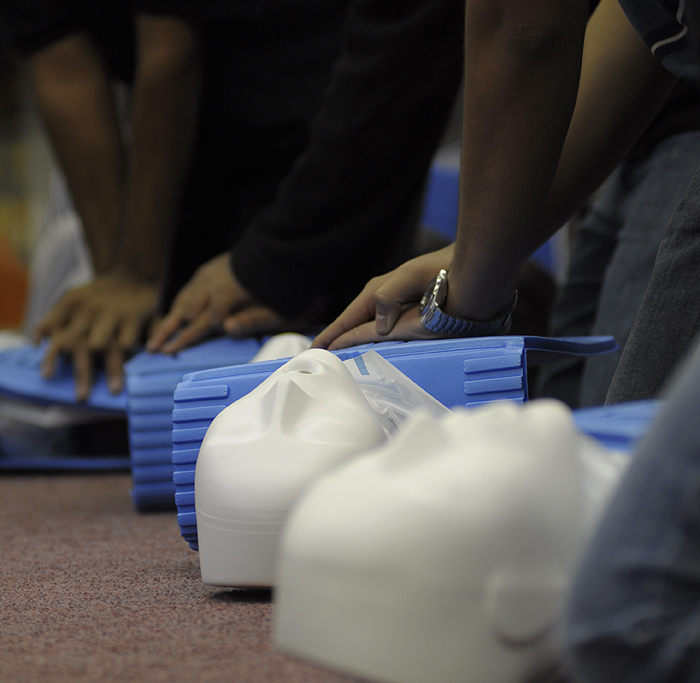 Students practise CPR on training dummies. Matthew Filipowich/The Medium