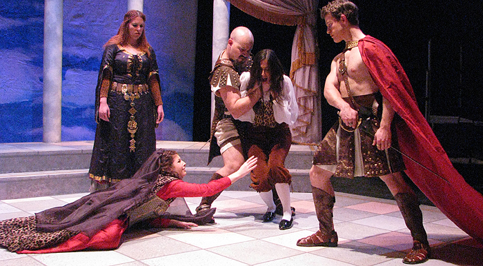 The captive Trojan prince is condemned to death unless Andromache yields (Kelsey Goldberg, Melanie Hrymak, Philippe Jullian, Brittany Kay, Darren Turner). James W. Smagata photo 