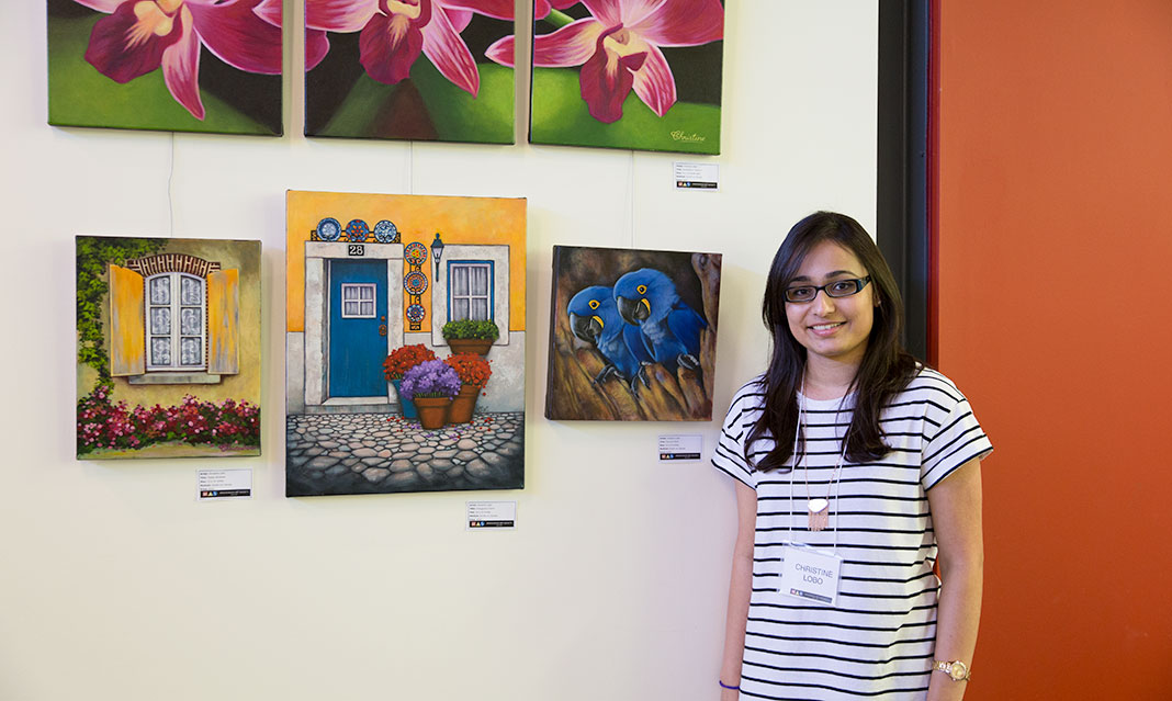 UTM alumna Christine Lobo combines realism and cartoons to produce brightly coloured paintings.
